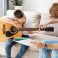 tutor-showing-his-student-how-hold-hand-guitar_23-2148573986[1]